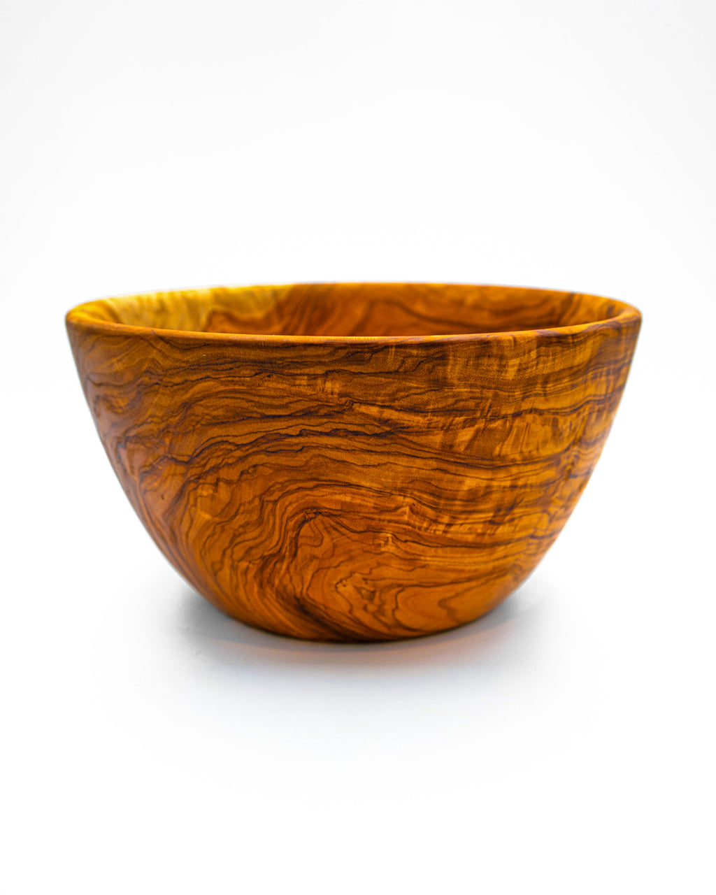 Side profile of a hand-carved olive wood centerpiece bowl highlighting its deep vessel design and sturdy, rustic aesthetic.