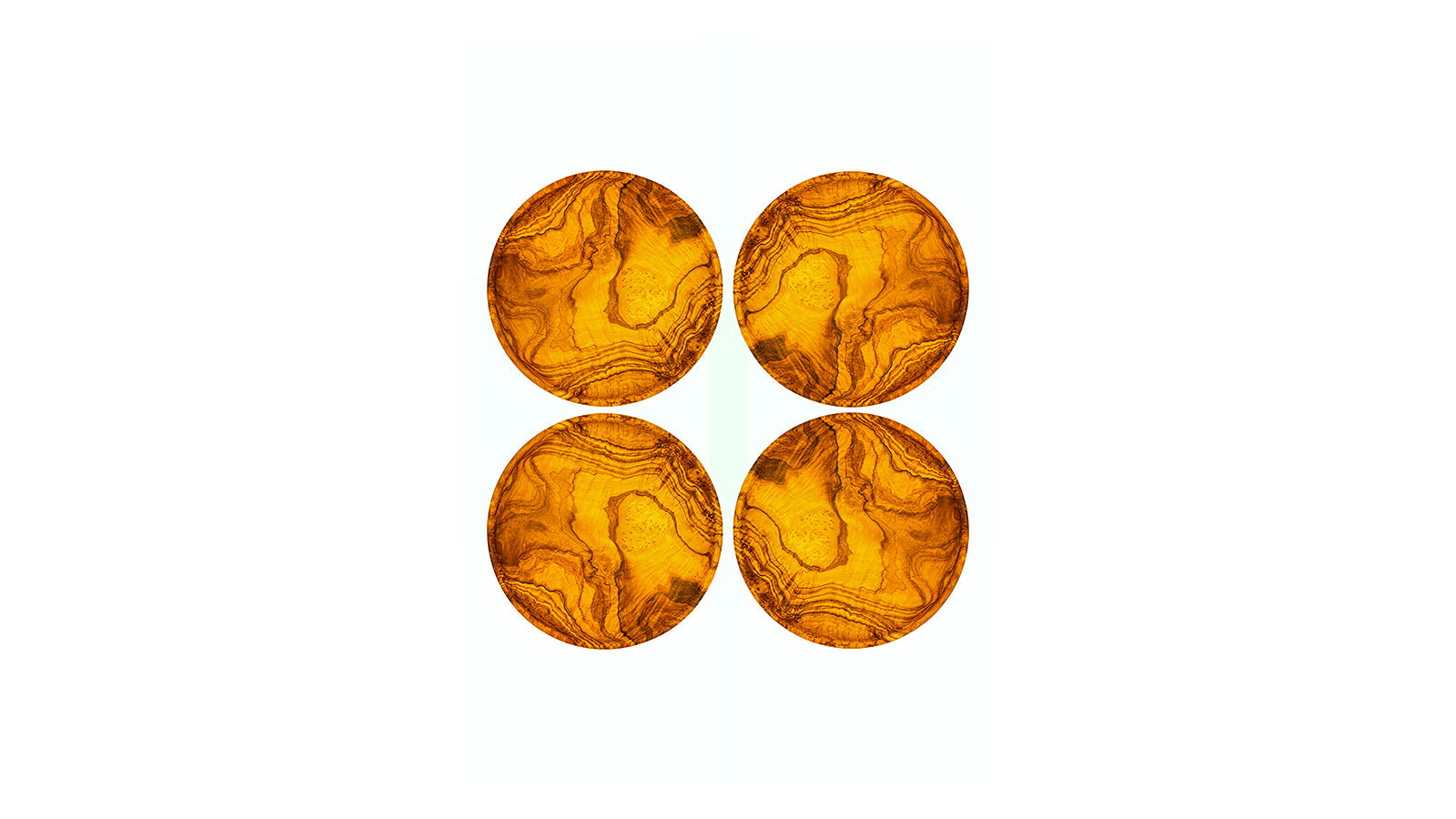 Set of four small circular olive wood appetizer plates showing rich, swirled natural wood grain, perfect for tapas or bread.