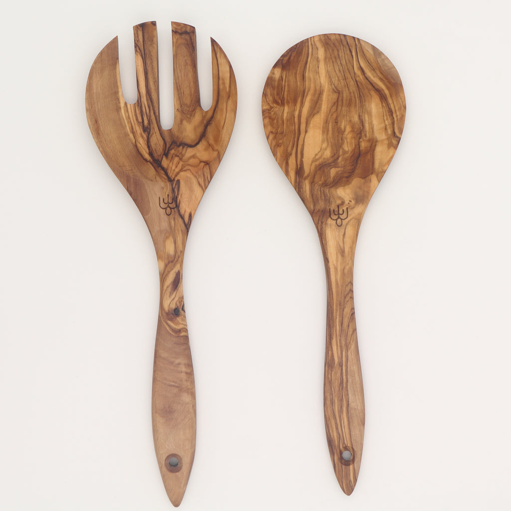 Handcrafted olive wood salad serving set with fork and spoon, showing natural grain.