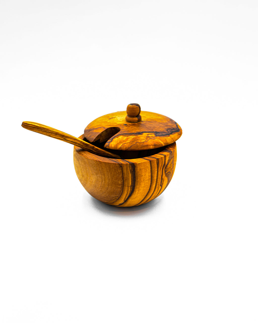 Handcrafted single olive wood salt cellar with a closed swivel lid and matching mini spoon.