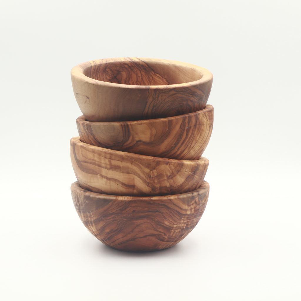 Handcrafted olive wood snack and dip bowls, set of 4, stacked to show natural grain variation.