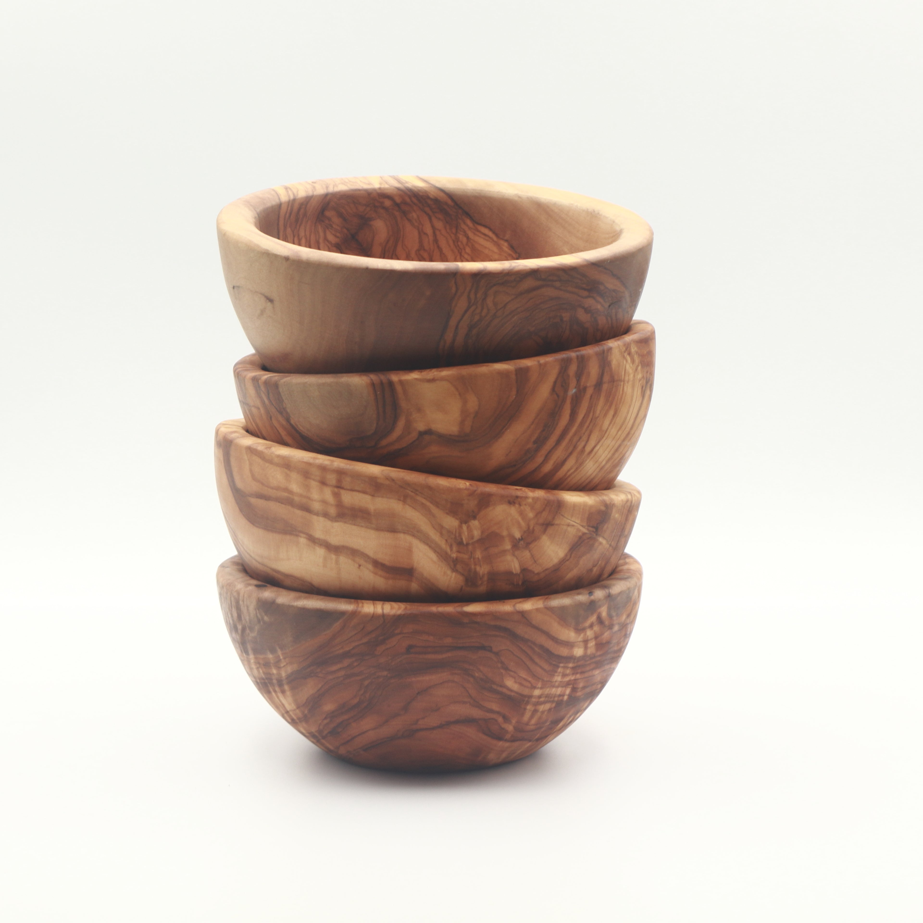 Handcrafted olive wood snack and dip bowls, set of 4, stacked to show natural grain variation.