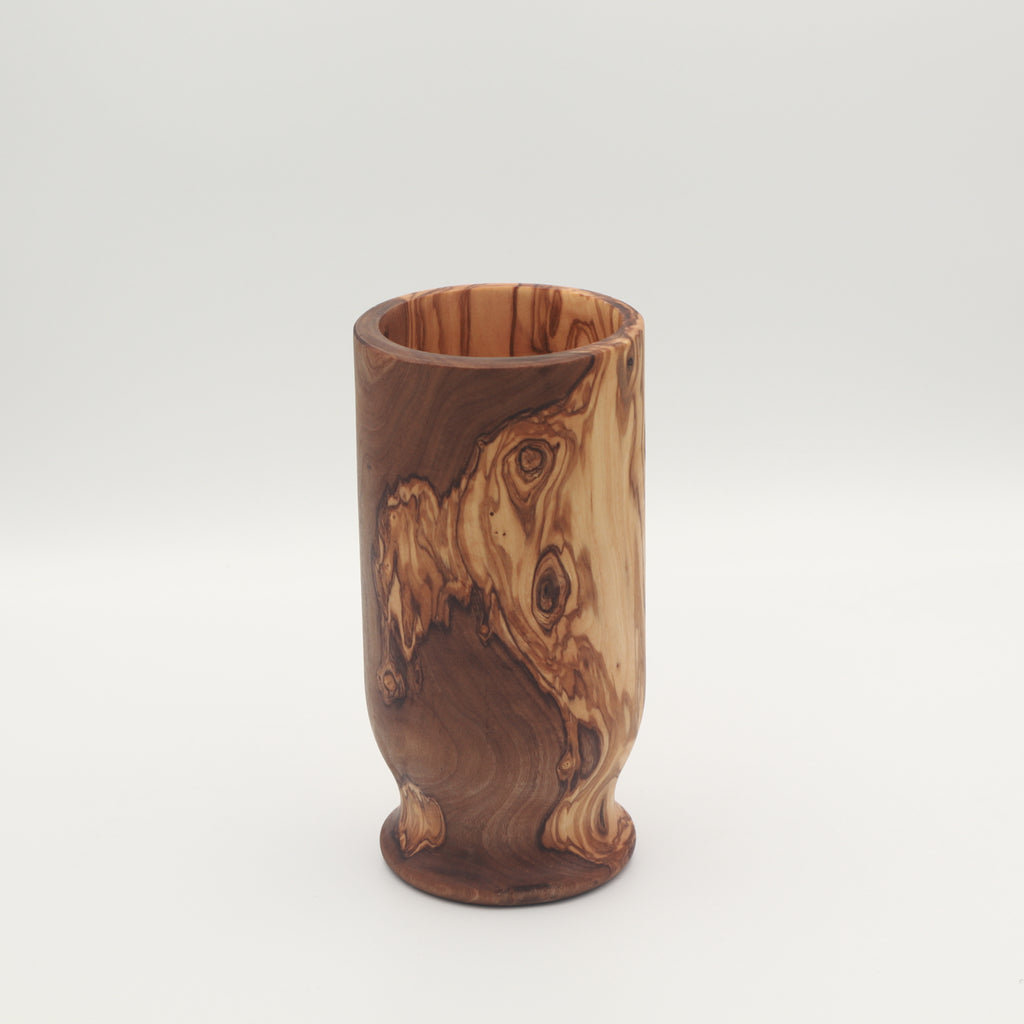 Handcrafted Tunisian olive wood utensil holder shown empty on a white background highlighting the natural grain.