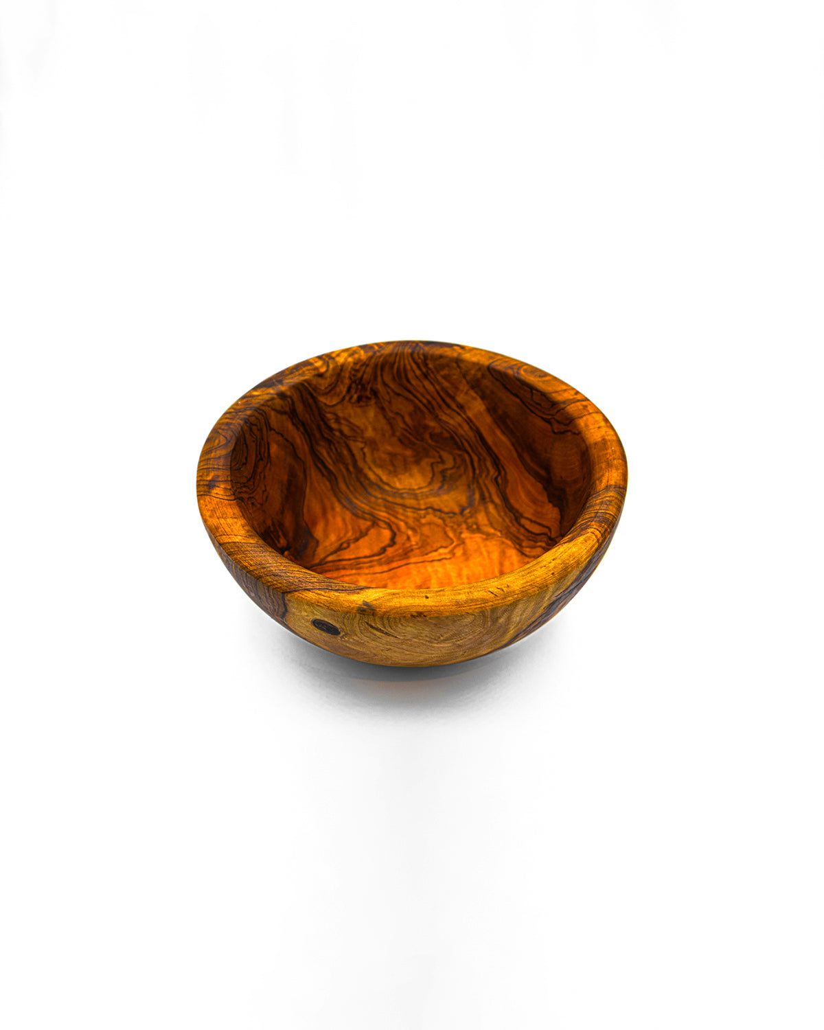 Single rustic handmade olive wood snack bowl with a deep natural grain and smooth carved finish.