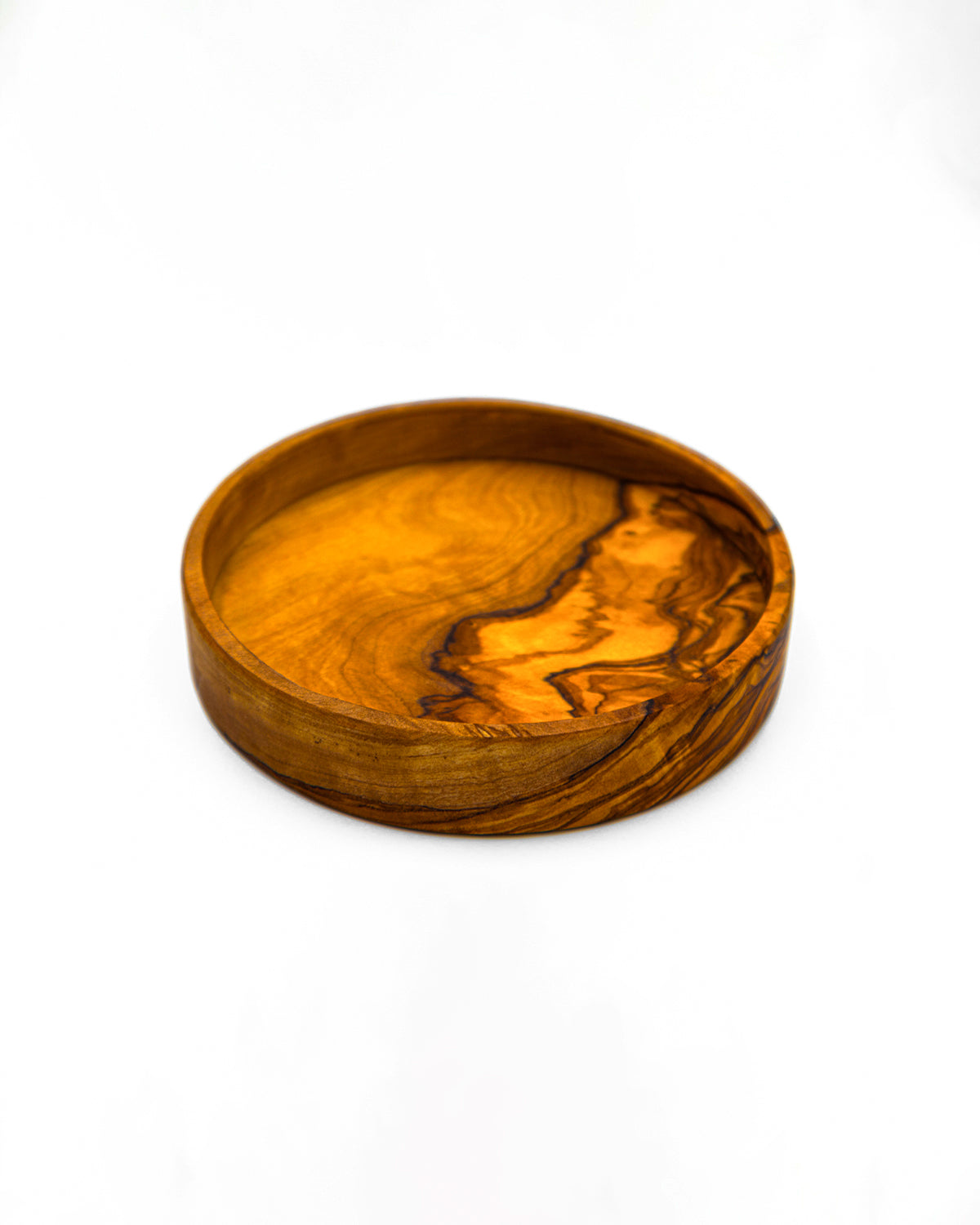 Perspective view of a rustic olive wood condiment dish, ideal for serving sauces, nuts, or spices.