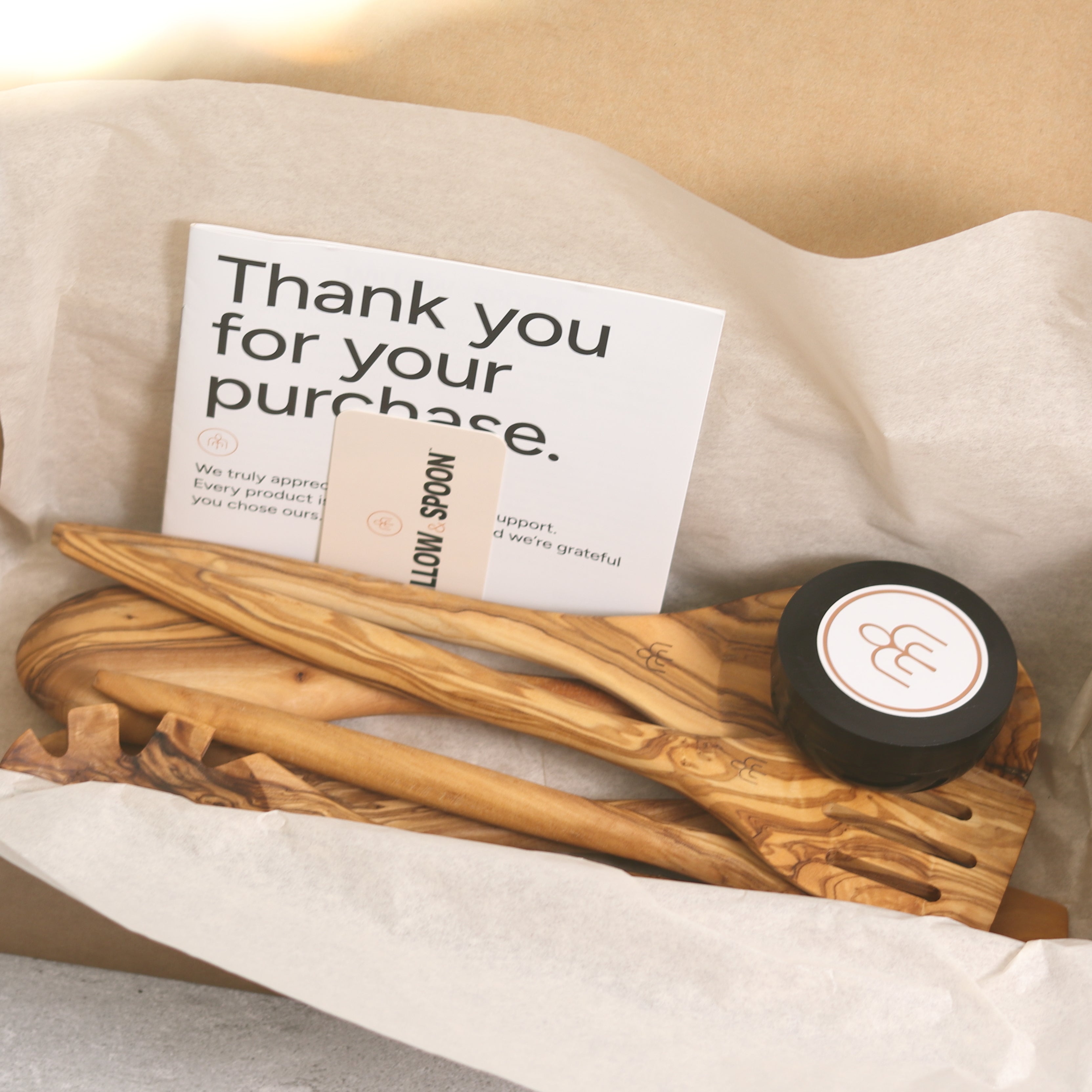 Olive wood salad servers packaged in a Willow & Spoon gift box with tissue paper, branded coaster, and thank you card