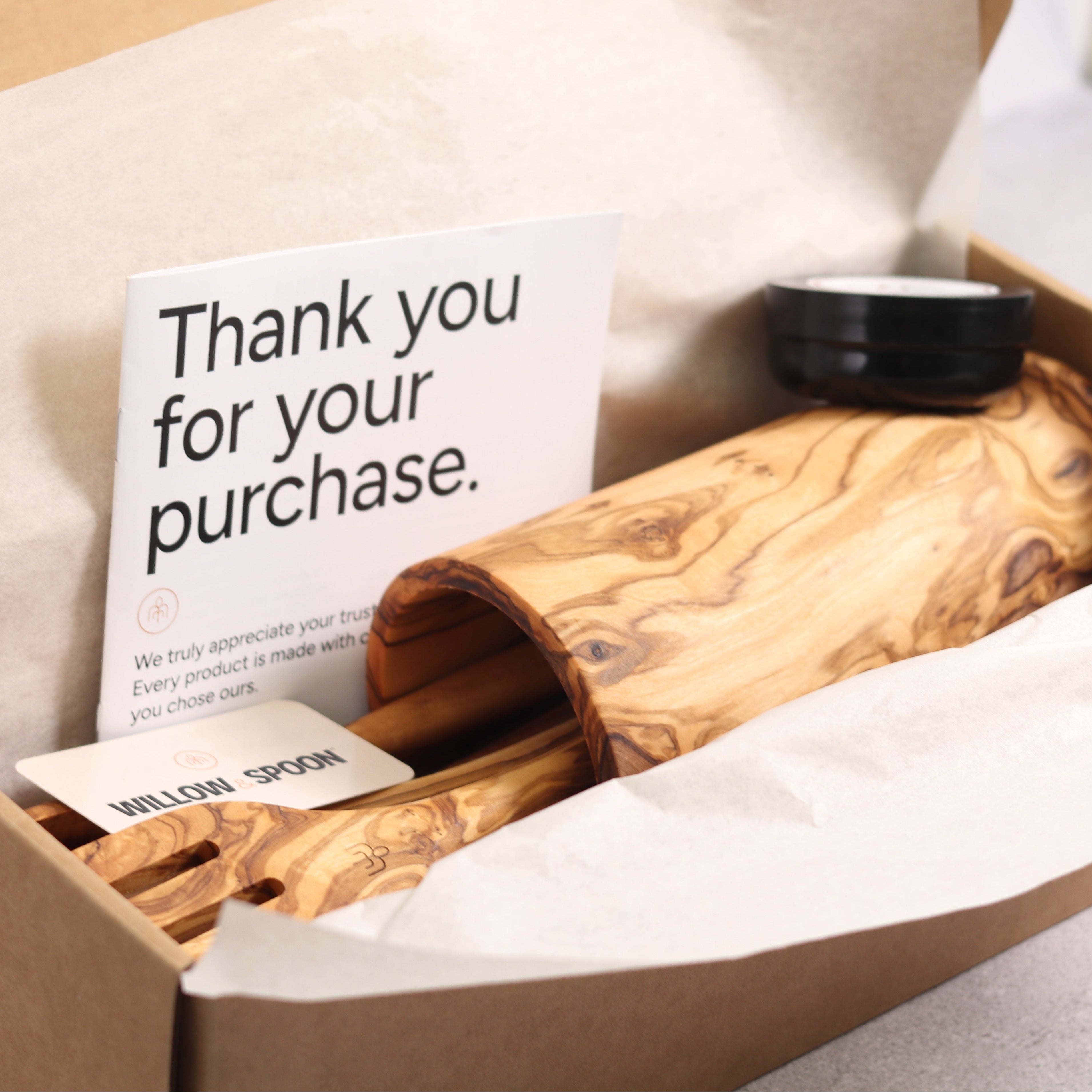 Olive wood utensil set with holder packaged in a Willow & Spoon gift box with tissue paper, branded coaster, and thank you card