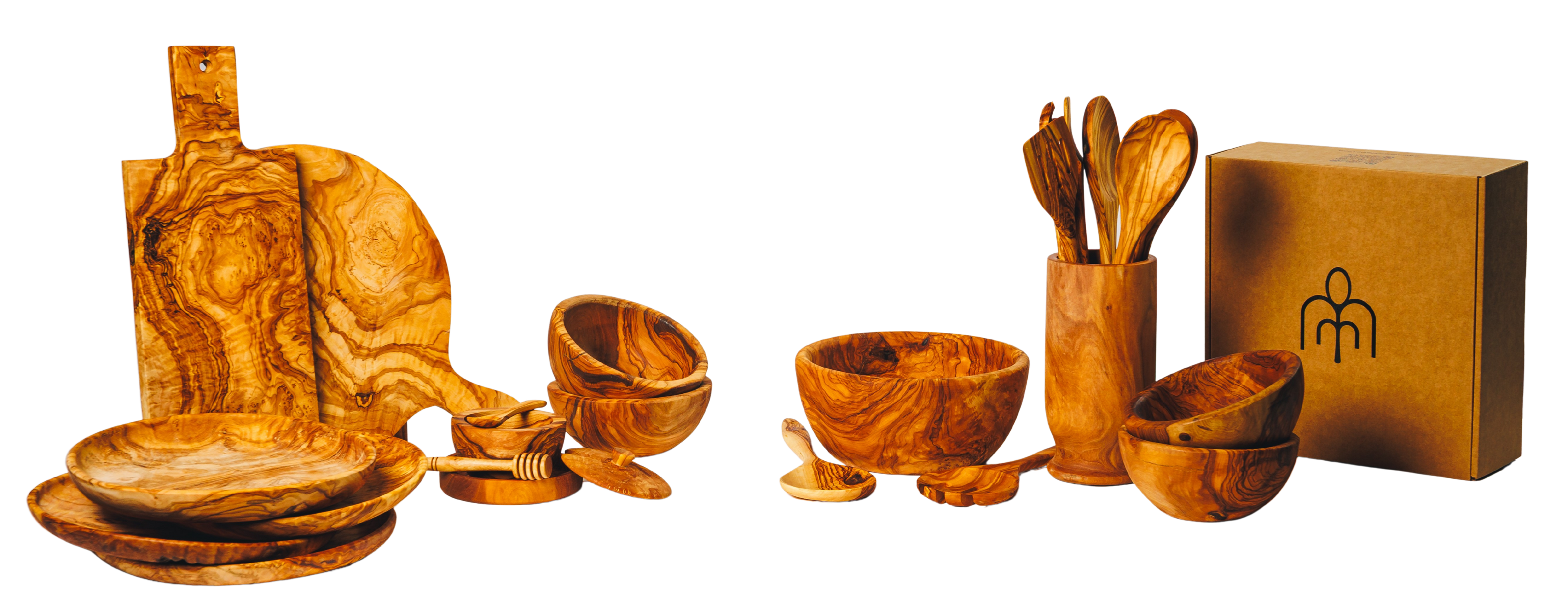 A curated collection of Willow and Spoon handcrafted olive wood kitchen tools, including bowls and spoons on a rustic surface.